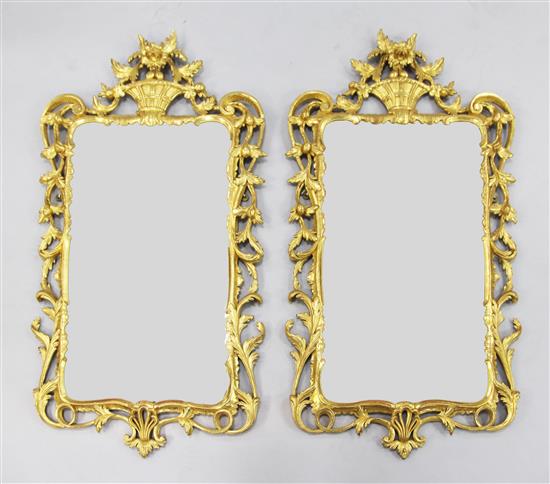 A pair of giltwood wall mirrors, 3ft 6.5in. x 1ft 9in.